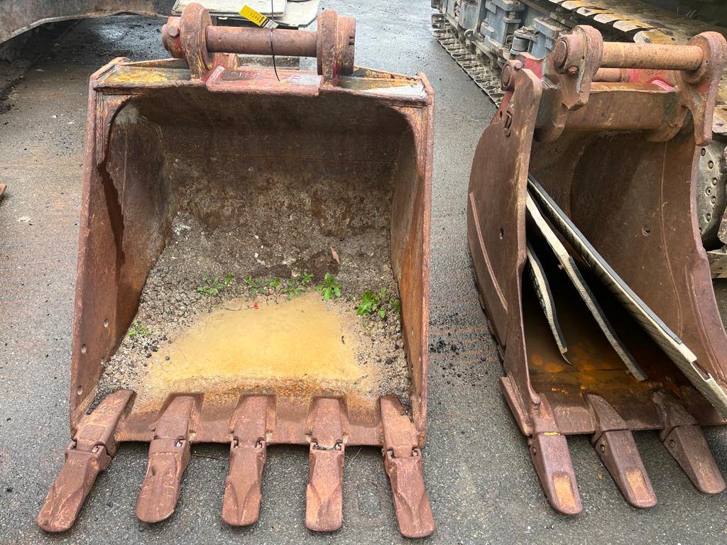 Excavator buckets from the Case CX300C parts machine